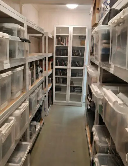 Cluttered storage room transformed into ordered, labelled shelving